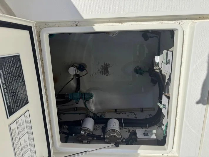 Warbird Yacht Photos Pics 2014 SeaVee 390B Center Console engine compartment with visible components and wiring.