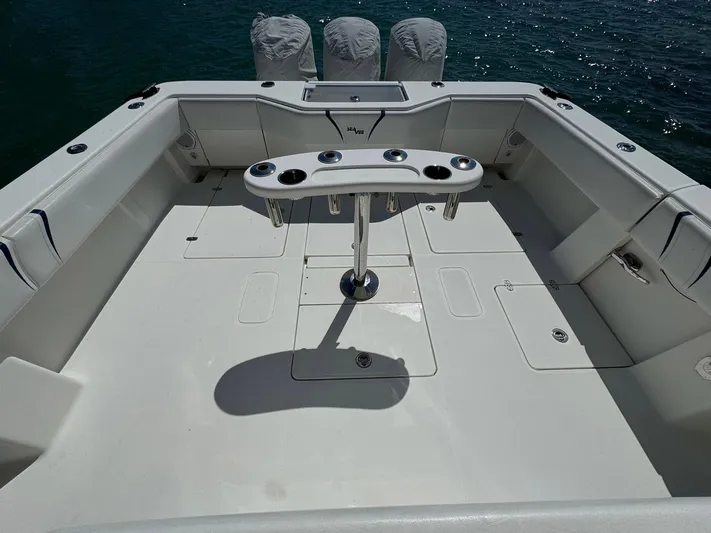 Warbird Yacht Photos Pics 2014 SeaVee 390B Center Console boat deck with rod holders, ocean in background.