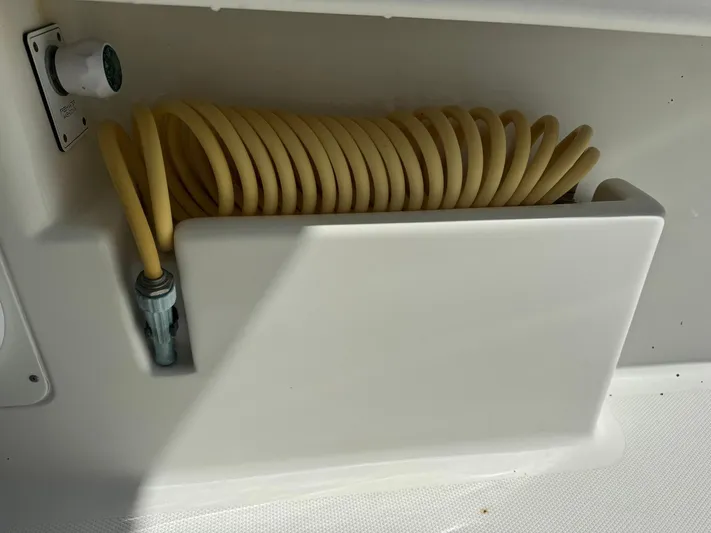 Warbird Yacht Photos Pics Coiled hose storage on 2014 SeaVee 390B Center Console boat.
