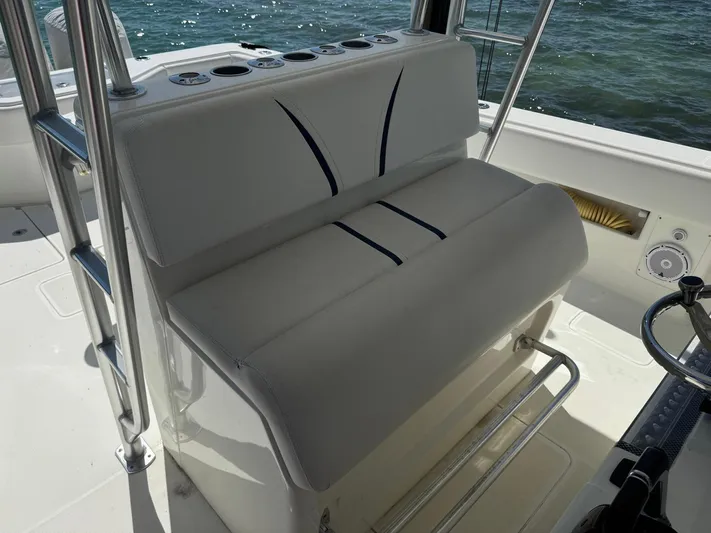 Warbird Yacht Photos Pics 2014 SeaVee 390B Center Console boat interior with cushioned seating and ocean view.