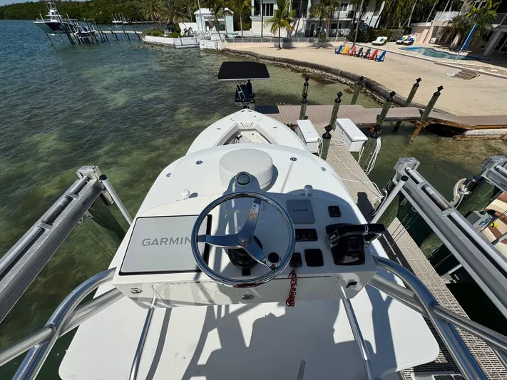 Warbird Yacht Photos Pics 2014 SeaVee 390B Center Console boat docked, featuring Garmin navigation system.