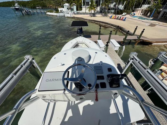 Warbird Yacht Photos Pics 2014 SeaVee 390B Center Console boat docked, featuring Garmin navigation system.