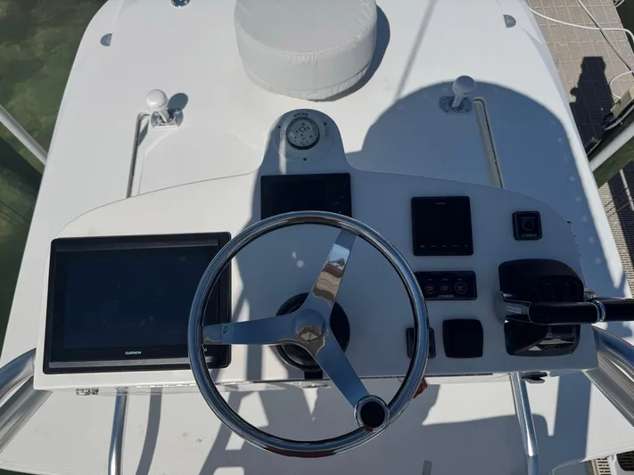 Warbird Yacht Photos Pics 2014 SeaVee 390B Center Console helm with steering wheel and navigation displays.