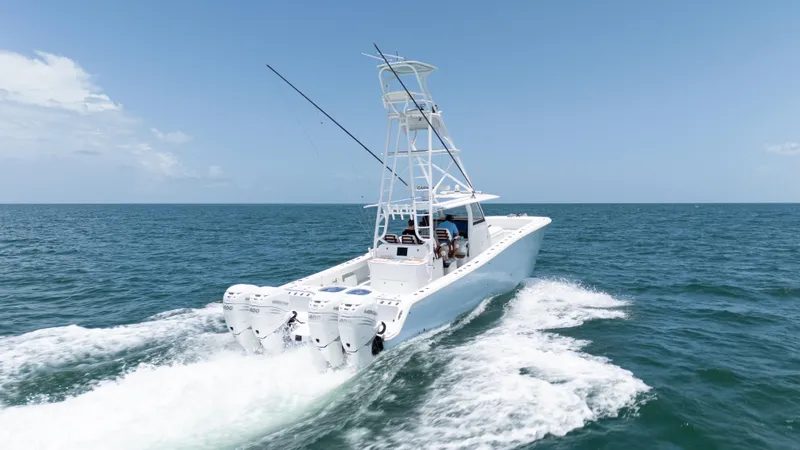  Yacht Photos Pics 2022 Freeman 43 boat cruising on open sea with clear blue sky.