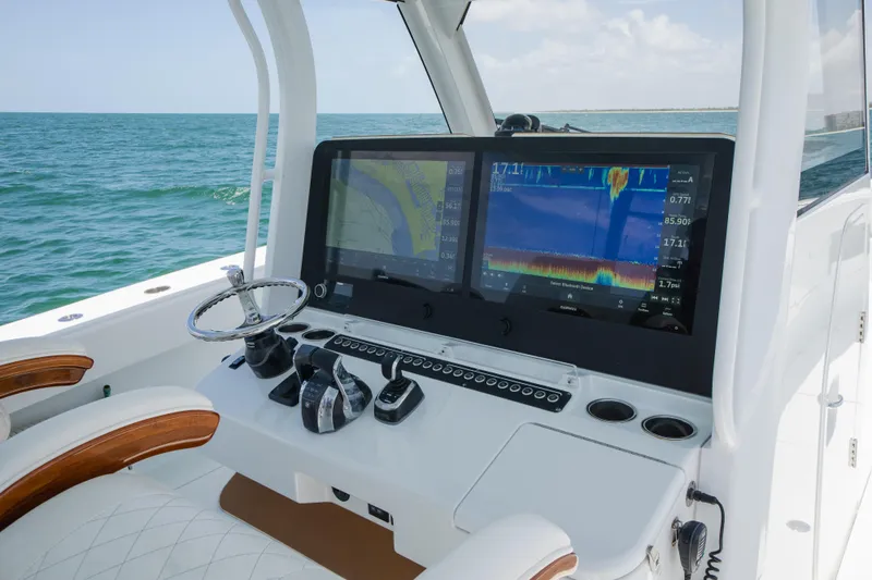  Yacht Photos Pics Freeman 43 boat dashboard with dual screens and steering wheel, 2022 model.