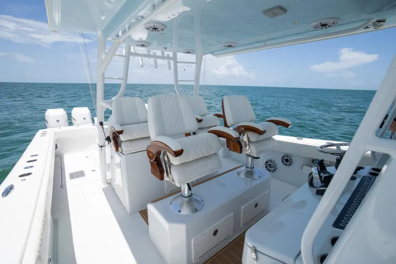  Yacht Photos Pics Luxury seating on a 2022 Freeman 43 boat, overlooking the ocean.