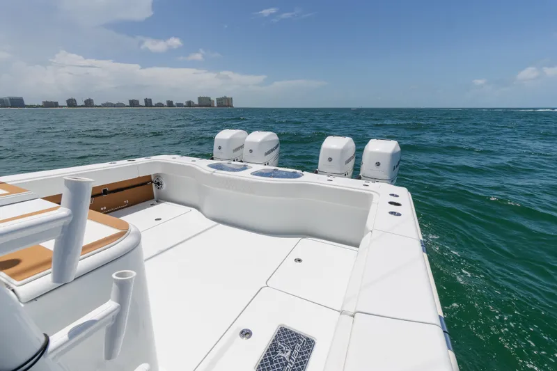  Yacht Photos Pics 2022 Freeman 43 boat on ocean with city skyline in background.