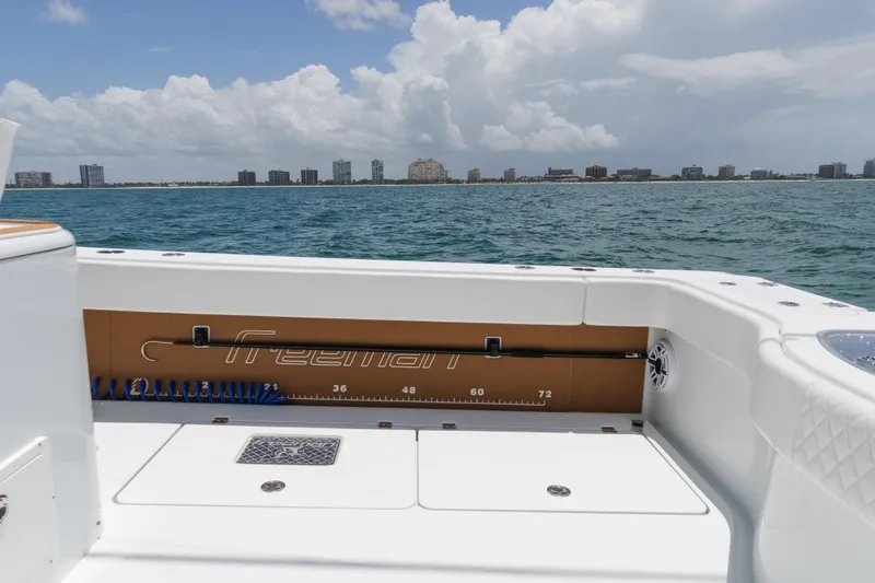  Yacht Photos Pics Freeman 43 boat deck with ocean view, 2022 model, city skyline in background.