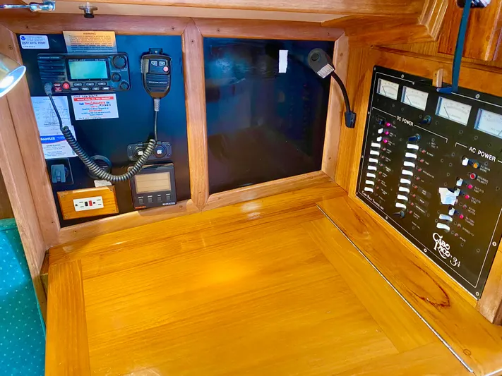 Private Idaho Yacht Photos Pics Control panel of a 1993 Cabo Rico 34 sailboat with navigation and communication equipment.