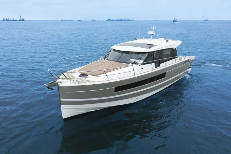 La Sirena Yacht Photos Pics 2014 Jeanneau NC 14 yacht cruising on open water.