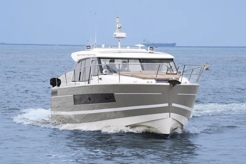 La Sirena Yacht Photos Pics 2014 Jeanneau NC 14 yacht cruising on open water.