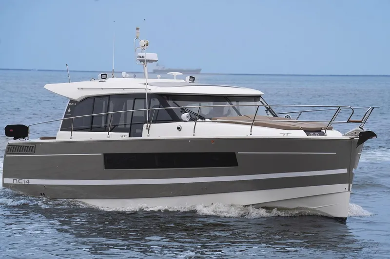La Sirena Yacht Photos Pics 2014 Jeanneau NC 14 motor yacht cruising on open water.