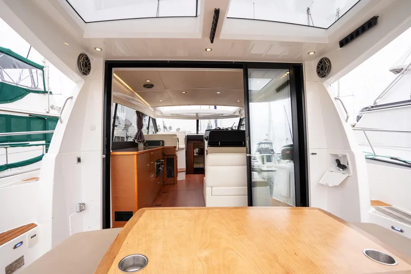 La Sirena Yacht Photos Pics 2014 Jeanneau NC 14 yacht interior with modern design and spacious seating area.