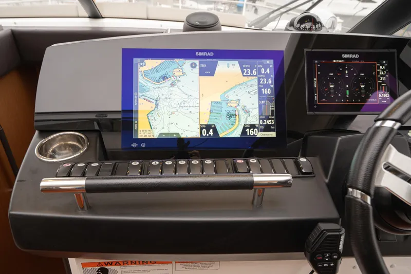 La Sirena Yacht Photos Pics Control panel of a 2014 Jeanneau NC 14 boat with Simrad navigation system.