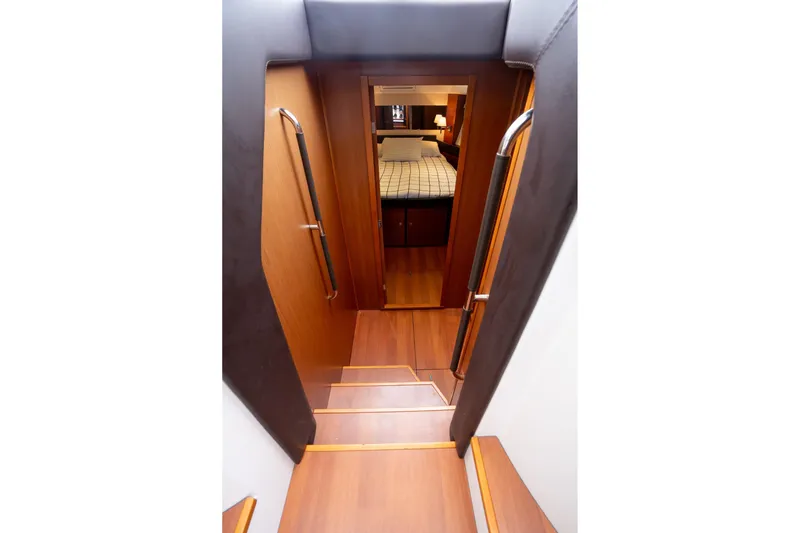 La Sirena Yacht Photos Pics Stairway leading to cabin interior of 2014 Jeanneau NC 14 yacht.