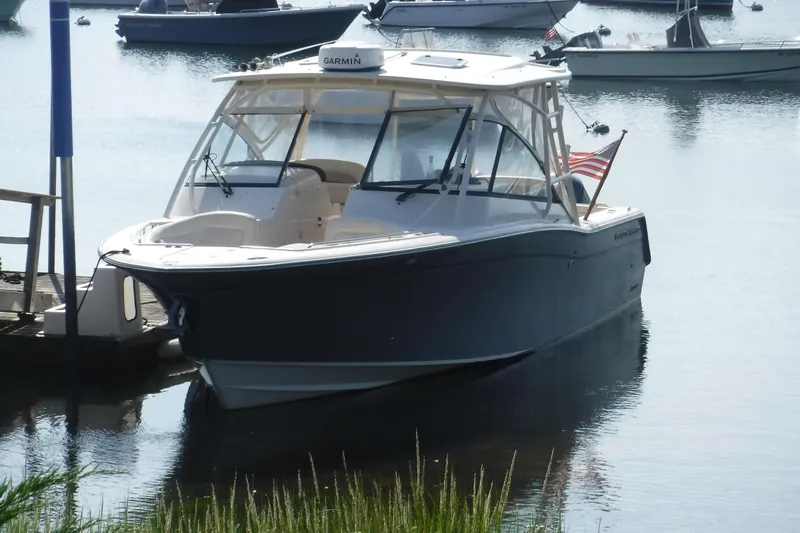  Yacht Photos Pics 2016 Grady White 355 Freedom boat docked in a serene marina setting.