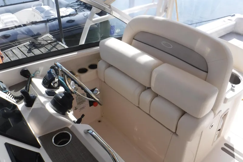  Yacht Photos Pics 2016 Grady White 355 Freedom boat helm with steering wheel and controls.