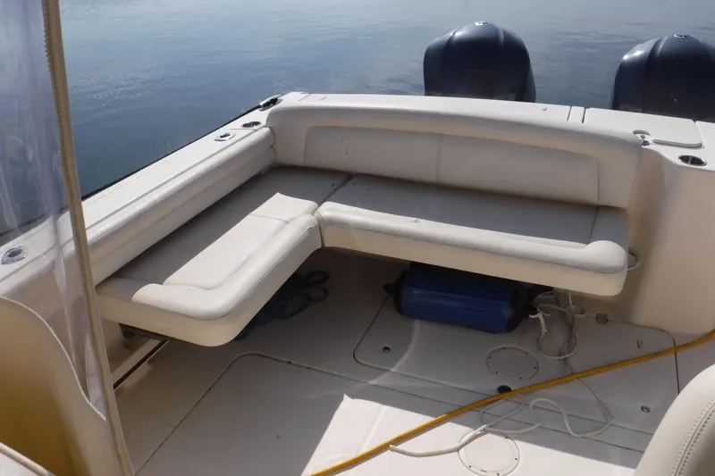  Yacht Photos Pics 2016 Grady White 355 Freedom boat interior with cushioned seating and twin engines.