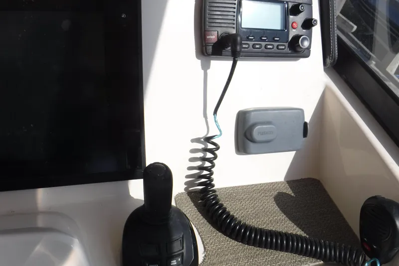  Yacht Photos Pics Control panel of 2016 Grady White 355 Freedom boat with radio and joystick.