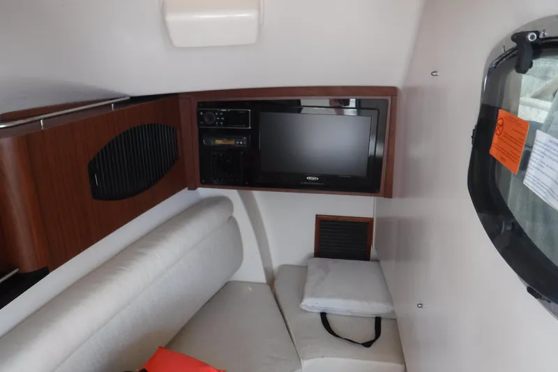  Yacht Photos Pics Interior of 2016 Grady White 355 Freedom boat with TV and seating area.