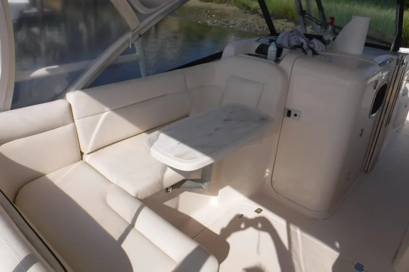  Yacht Photos Pics Interior of 2016 Grady White 355 Freedom boat with white seating and table.