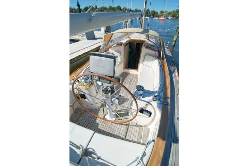  Yacht Photos Pics 2006 Alerion Express 38 sailboat cockpit with wooden accents and steering wheel.