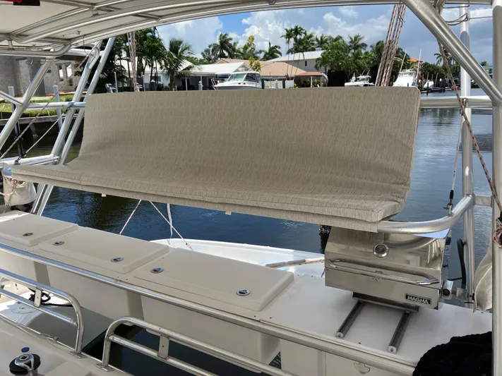 Bel Tempo Yacht Photos Pics Manta 42 MkIV 2008 yacht with covered seating area by the water.