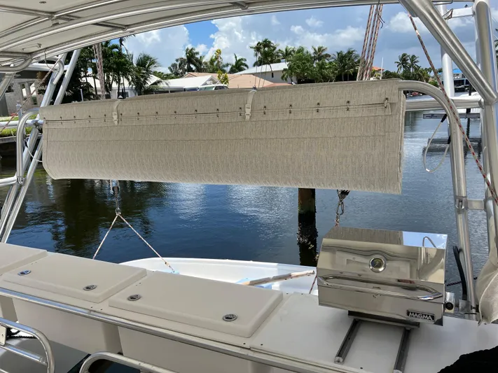 Bel Tempo Yacht Photos Pics 2008 Manta 42 MkIV yacht with outdoor grill and seating area by the water.