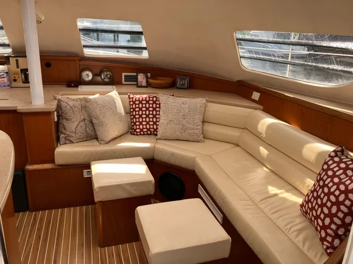 Bel Tempo Yacht Photos Pics Interior of 2008 Manta 42 MkIV yacht with cozy seating and decorative pillows.