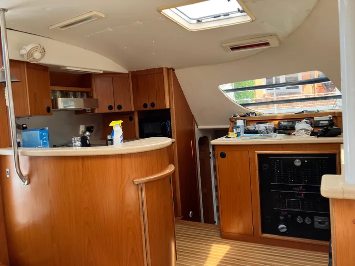 Bel Tempo Yacht Photos Pics Interior of 2008 Manta 42 MkIV yacht with wooden cabinetry and modern amenities.