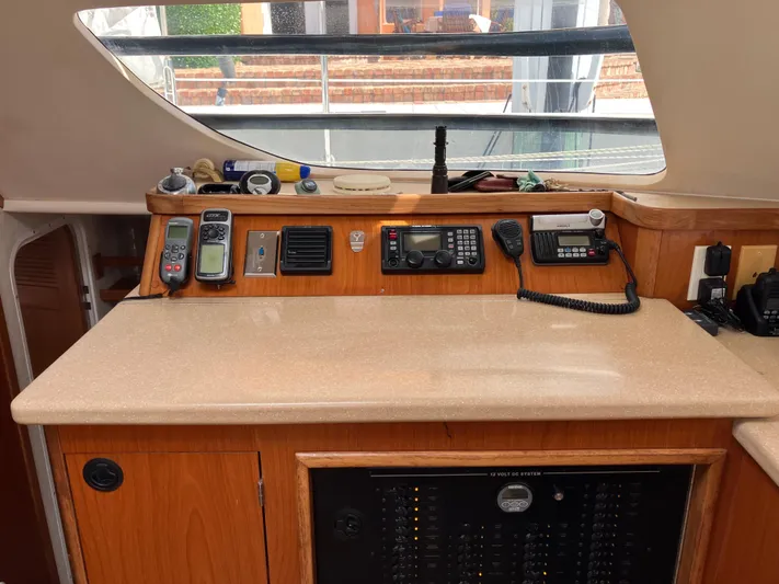 Bel Tempo Yacht Photos Pics Interior view of 2008 Manta 42 MkIV yacht navigation station with communication equipment.