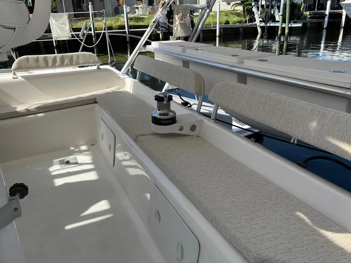 Bel Tempo Yacht Photos Pics Interior view of 2008 Manta 42 MkIV catamaran with cushioned seating and winch.