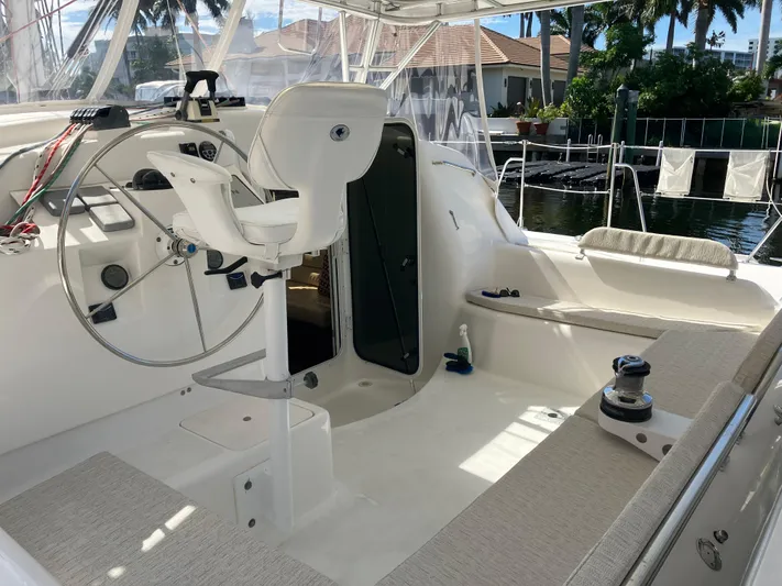 Bel Tempo Yacht Photos Pics 2008 Manta 42 MkIV yacht cockpit with steering wheel and seating area.