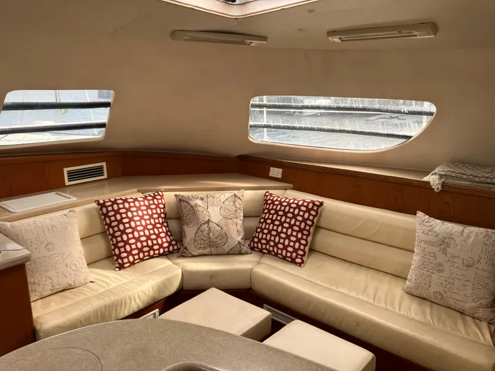 Bel Tempo Yacht Photos Pics Interior of 2008 Manta 42 MkIV yacht with cozy seating and decorative pillows.