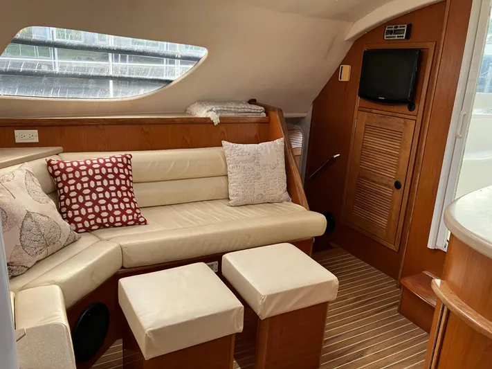 Bel Tempo Yacht Photos Pics Interior of 2008 Manta 42 MkIV yacht with cozy seating and modern decor.