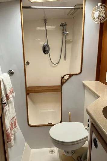 Bel Tempo Yacht Photos Pics Bathroom interior of 2008 Manta 42 MkIV yacht with shower and toilet.