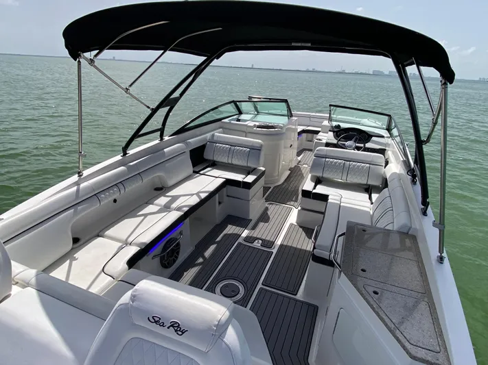 2015 Sea Ray 290 Sundeck Yacht Photos Pics 2015 Sea Ray 290 Sundeck boat with spacious seating and canopy on calm water.