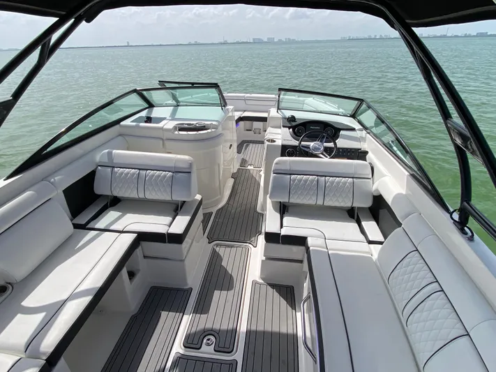 2015 Sea Ray 290 Sundeck Yacht Photos Pics 2015 Sea Ray 290 Sundeck boat interior with white seating and open water view.