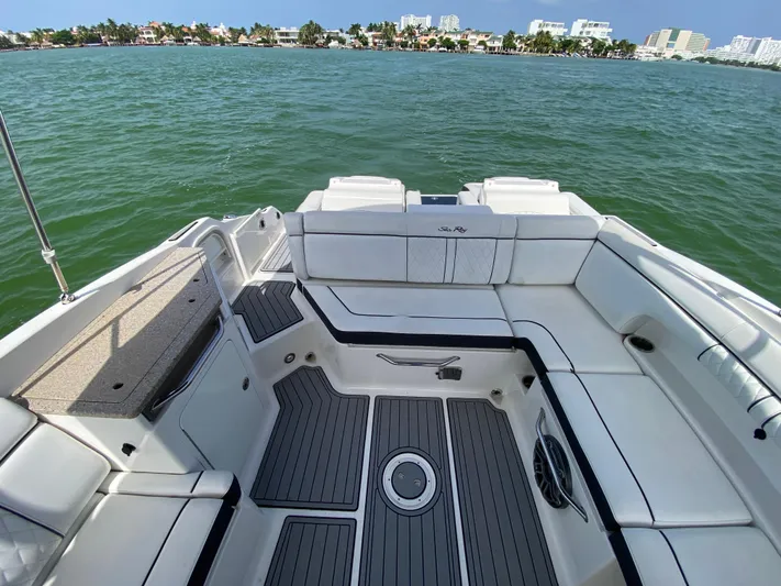 2015 Sea Ray 290 Sundeck Yacht Photos Pics 2015 Sea Ray 290 Sundeck boat interior with white seating and scenic water view.
