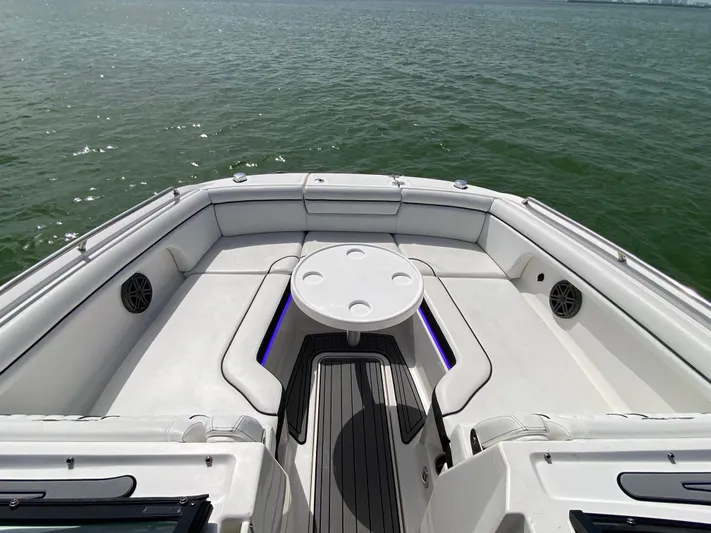 2015 Sea Ray 290 Sundeck Yacht Photos Pics 2015 Sea Ray 290 Sundeck boat interior with seating and table on open water.