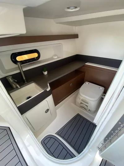 2015 Sea Ray 290 Sundeck Yacht Photos Pics 2015 Sea Ray 290 Sundeck interior with sink, toilet, and modern design.