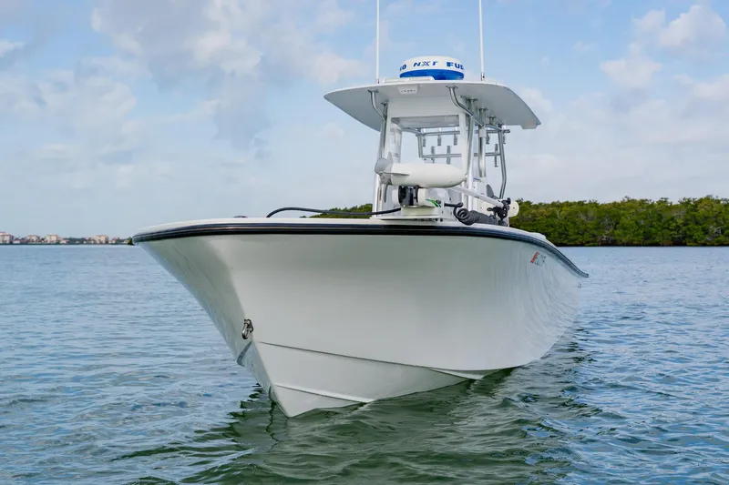  Yacht Photos Pics 2024 Orion 29CC boat on calm water, showcasing sleek design and modern features.