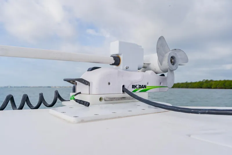  Yacht Photos Pics Trolling motor on Orion 29CC boat, 2024 model, with scenic water background.