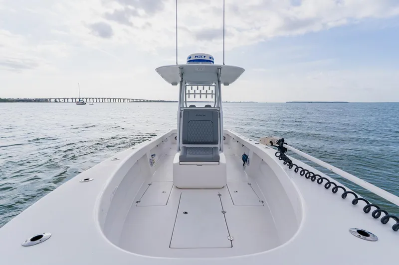  Yacht Photos Pics 2024 Orion 29CC boat on open water, showcasing sleek design and spacious deck.