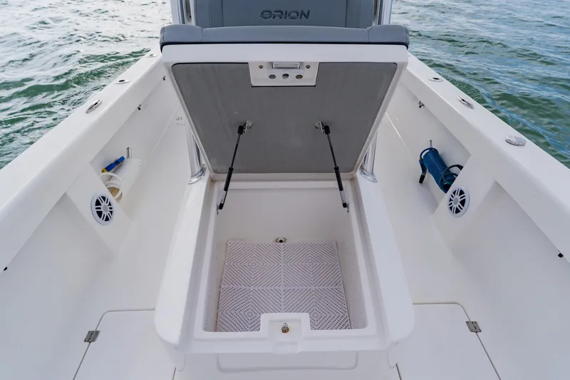  Yacht Photos Pics 2024 Orion 29CC boat storage compartment open, showcasing spacious interior design.