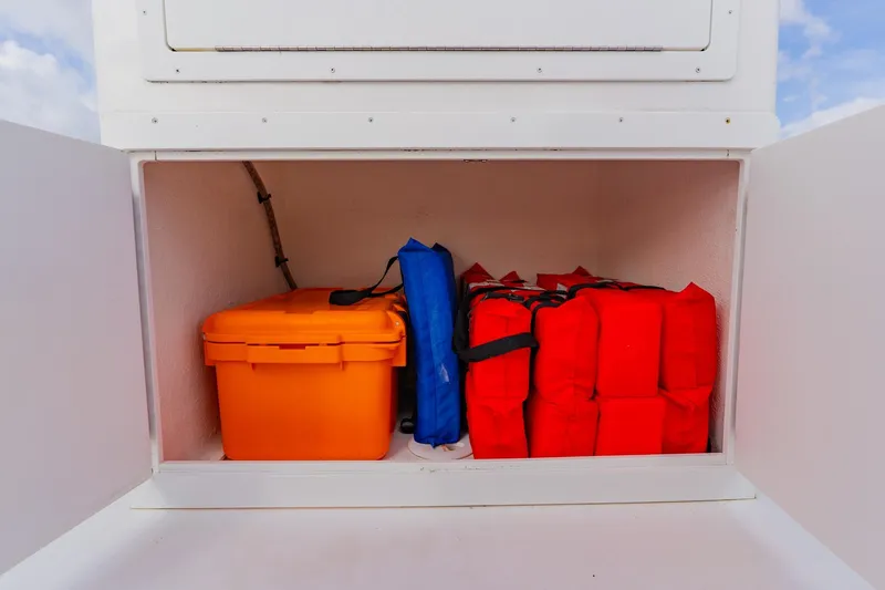  Yacht Photos Pics Storage compartment on 2024 Orion 29CC boat with safety gear and equipment.