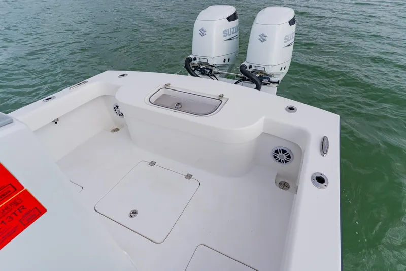  Yacht Photos Pics 2024 Orion 29CC boat with dual Suzuki outboard motors on water.