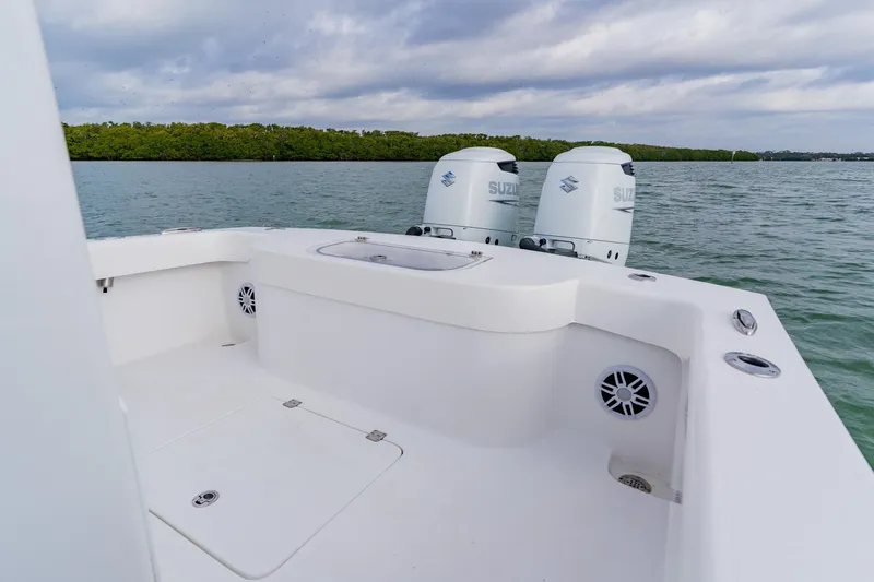  Yacht Photos Pics 2024 Orion 29CC boat with dual Suzuki engines on calm water.