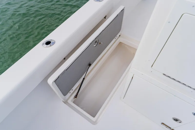  Yacht Photos Pics Open storage compartment on 2024 Orion 29CC boat, showcasing sleek design and functionality.