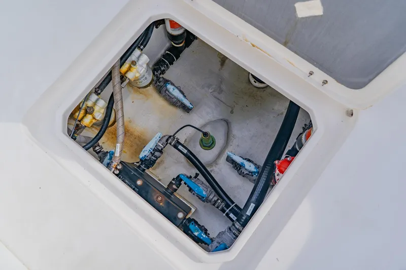  Yacht Photos Pics Engine compartment of 2024 Orion 29CC boat, showing hoses and components.